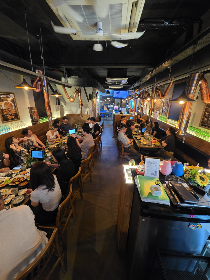 Large group dining together at Hongdae Korean BBQ